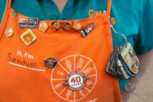 Home Depot apron with badges and buttons