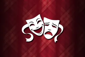 Theater masks happy and sad on a red tartan background