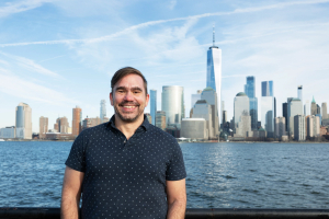 Cameron Brown in front of the NYC skyline