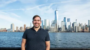 Cameron Brown in front of the NYC skyline